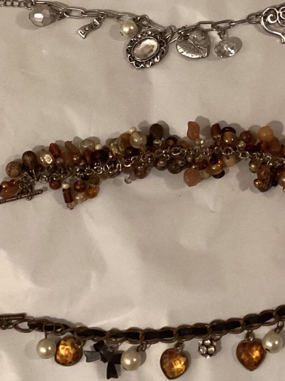 Three charm bead bracelets
